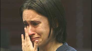 Casey Anthony wipes tears from her eyes at a bond hearing at the Orange County courthouse in Orlando, Fla. 