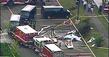 Small Plane Crashes Into Parking Lot - CBS News