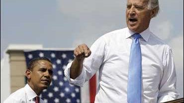 Democratic presidential candidate Sen. Barack Obama, D-Ill., listens as vice presidential running mate Sen. Joe Biden, D-Del., speaks at a rally 