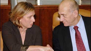Israeli Prime Minister Ehud Olmert, right, shakes hands with Foreign Minister Tzipi Livni 