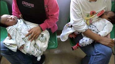 A Chinese mother breastfeeds her baby at the Children's hospital in Beijing. 