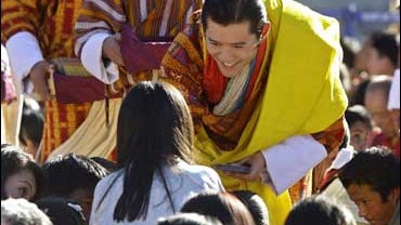 Bhutan's 5th King Jigme Khesar Namgyal Wangchuk, center, interacts with members of the public during a coronation ceremony at the Tendrel Thang ceremonial ground adjoining the Tashichho Dzong in Thimpu, Bhutan on Nov. 6, 2008. 
