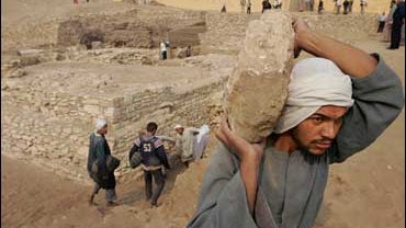 Archaeology workers at site of newly discovered pyramid. 