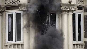 The windows on the first floor of the Taj Mahal hotel shatter after the use of a grenade launcher in Mumbai, India, Nov. 28, 2008. 