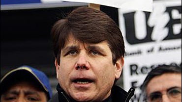 Ill. Gov. Rod Blagojevich stands with workers on the fourth day of a sit-in at the Republic Windows and Doors factory Monday, Dec. 8, 2008 in Chicago. 