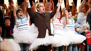 Pictured from second left, Kiril Kulish, Elton John, Trent Kowalik and David Alvarez, appear on stage in tutus for the curtain call at the Broadway opening of "Billy Elliot The Musical," in New York, Thursday, Nov. 13, 2008. 
