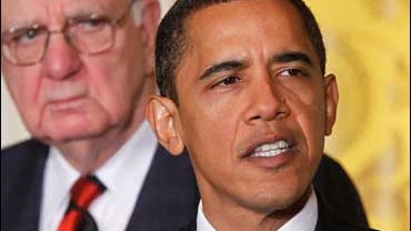 President Barack Obama accompanied by Economic Recovery Advisory Board Chair Paul Volcker, left, speaks in the East Room of the White House in Washington 