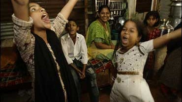 Neighbors of "Slumdog Millionaire" actor Rubina Ali, dance as the award-winning original song "Jai Ho" is played during the telecast of the 81st Annual Academy Awards 