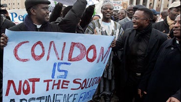 Sign "Condom is not the solution, Abstinence, Fidelity" 