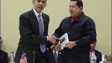 Venezuela's President Hugo Chavez, right, hands President Barack Obama a book titled "The Open Veins of Latin America" by Uruguayan writer Eduardo Galeano, during a UNASUR countries meeting at the Summit of the Americas on Saturday, April 18, 2009 in Port 