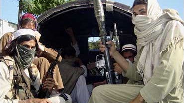 Pakistani Taliban members travel in a van as they leave Buner, northwestern Pakistan on Friday, April 24, 2009. 
