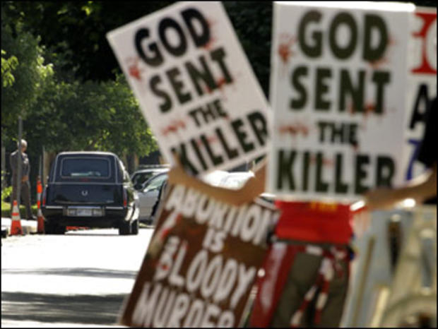 Protesters from Rev. Fred Phelps' Westboro Baptist Church demonstrate during funeral services for Dr. George Tiller Saturday, June 6, 2009, at College Hill United Methodist Church in Wichita, Kan. 
