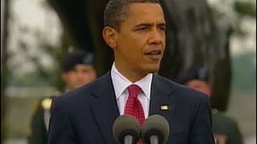 President Barack Obama speaks at a ceremony commemorating the 65th anniversary of D-Day at the American cemetery in Colleville-sur-Mer, Normandy, June 6, 2009. 