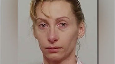 A police booking photo of Cecile Brossard, who was arrested shortly after the 2005 murder of French banker Edouard Stern. 