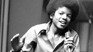 In this 1972 file photo, singer Michael Jackson at age 13, the youngest member of the singing group Jackson Five, sings in his home in Encino, Ca. (AP Photo, file) 