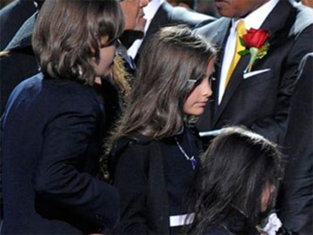 Prince Michael Jackson I, left, Paris Jackson and Prince Michael Jackson II walk off stage during the memorial service for Michael Jackson at the Staples Center in Los Angeles, Tuesday, July 7, 2009. (AP Photo/Mark J. Terrill, Pool) 