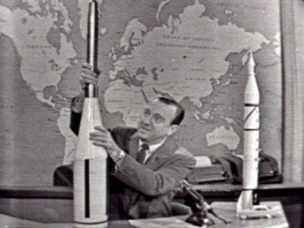 Anchorman Walter Cronkite uses models to explain America's Explorer 1 mission to viewers on the CBS television network in 1958. 