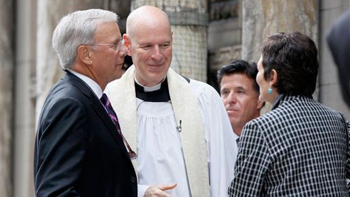 NBC newsman Tom Brokaw, left, and his wife, Meredith, right, talk with Rev. William McD. Tully of St. Bartholomew's Church as they arrive for Walter Cronkite's funeral at the church on Park Ave. in New York, Thursday, July 23, 2009. Cronkite died last Fri 