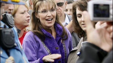 Alaska Gov. Sarah Palin, stops for a photo during the governor's picnic in Anchorage, Alaska Saturday, July 25, 2009. Several thousand people attended the picnic. Palin will attend one more picnic in Fairbanks on Sunday where she will resign as Alaska's g 