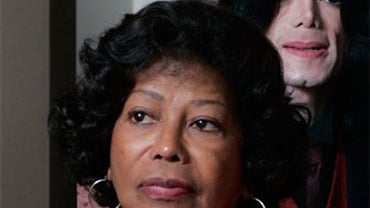 In this May 20, 2005 file photo, Michael Jackson, background, and his mother Katherine Jackson pass through a security check point on the way to his child molestation trial at the Santa Barbara County Courthouse in Santa Maria, Calif. (AP Photo/Robyn Beck 