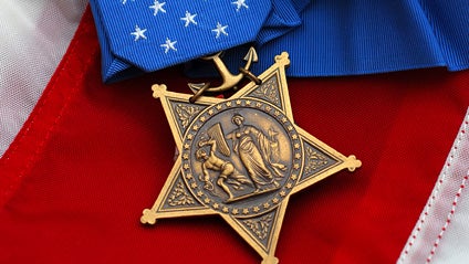 Photo of the Medal of Honor presented posthumously to the parents of U.S. Navy Master-at-Arms 2nd Class (SEAL) Michael A. Monsoor at the White House in Washington, D.C., April 8, 2008. 