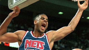 New Jersey Nets' Jayson Williams (55) yells out after dunking against the Detroit Pistons in the first quarter Friday, March 22, 1996, in Auburn Hills, Mich. Detroit won 111-96. (AP Photo/Duane Burleson) 