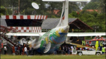 A Bangkok Airways plane is seen after it skidded off the runway while attempting to land during heavy rains on Samui island, Surat Thani province in southern Thailand Tuesday, Aug. 4, 2009. The domestic airliner crashed into an old air traffic control tow 