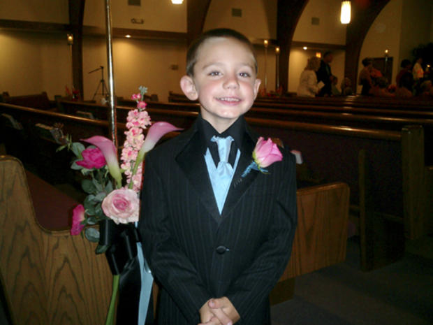 In this Aug. 2007 photo provided by Michael Chekevdia, Richard Chekevdia poses at a wedding in West Frankfort, Ill. Authorities say the boy, allegedly abducted in a custody dispute two years ago, has been found alive, hidden behind a wall at his grandmoth 