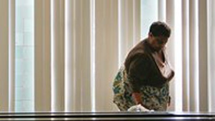 Merlene York uses disinfectant to wipe down lunch tables at Mary McAshan Gibbs Pre-K Center Tuesday, Sept. 29, 2009, in Huntsville, Texas. All schools in the Huntsville Independent School District are closed until Thursday due to students and staff being  