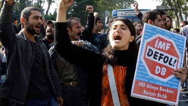 Leftist union members and students shout slogans during a protest against the policies of the International Monetary Fund and World Bank in Istanbul 