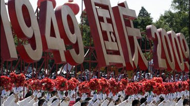 People march past Tiananmen Square during a military parade marking China's 60th anniversary in Beijing, China, Thursday Oct. 1, 2009. China celebrated its rise to a world power over 60 years of Communist rule Thursday, staging its biggest-ever parade of  
