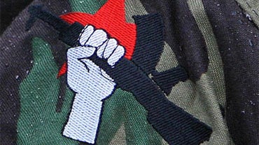 An INLA logo embroidered on the jacket, during a republican parade in Londonderry Sunday, December 9th, 2007. 