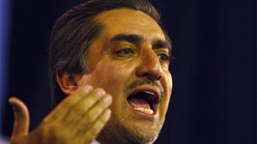 Afghanistan's presidential challenger Abdullah Abdullah announces his decision not to participate in Afghanistan's run-off election during a press conference in Kabul, Afghanistan, Sunday, Nov. 1, 2009. 