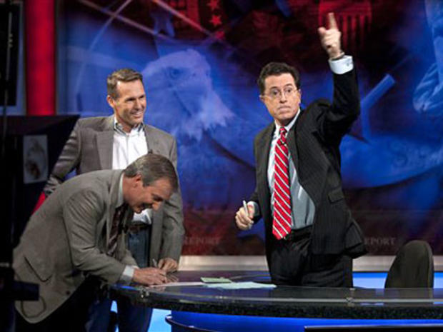 This photo provided by Comedy Central shows left foreground, U.S. Speedskating executive director Robert Crowley, Olympic gold medalist Dan Jansen and host Stephen Colbert on the set of "the Colbert Report" Monday night Nov. 2, 2009 in New York. Colbert a 