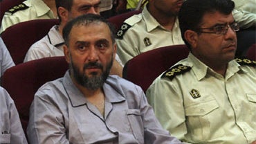 In this photo released by the semi-official Iranian Fars News Agency, former vice president Mohammad Ali Abtahi, left, is seen with other defendants at a court room in Tehran, Iran, Saturday, Aug. 1, 2009. 