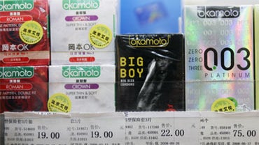 Condoms for sale are lined up at a convenience store next to the cash register in Beijing Wednesday, Nov. 26, 2008. 