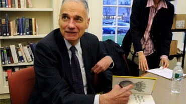 Ralph Nader signs a copy of his new book "Only the Super Rich Can Save Us!" during an appearance as part of a national book tour at the Noah Webster Library in West Hartford, Conn., on Friday, Nov. 27, 2009. 