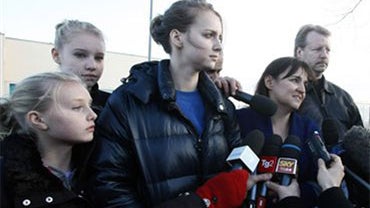 Amanda Knox's mother Edda Mellas, third from right, flanked by Amanda's sisters, from left, Delaney, Ashley and Deanna, and by Amanda's father Curt, second from right, answers journalists questions after visiting her daughter in a jail in the outskirts of 