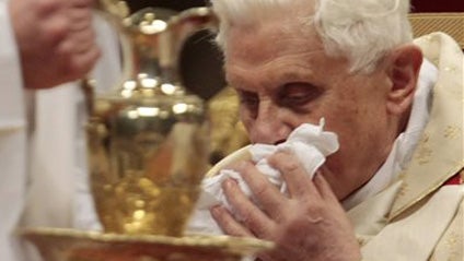 Pope Benedict XVI uses a handkerchief, during Christmas Mass in St. Peter's Basilica at the Vatican, Thursday, Dec. 24, 2009. 