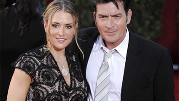 In this Sunday, Sept. 20, 2009, picture, actor Charlie Sheen, right, and wife Brooke Mueller arrive at the 61st Primetime Emmy Awards in Los Angeles. A woman who identified herself as the wife of Charlie Sheen said in a 911 call to Aspen police that the a 