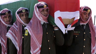 Jordanian guards of honor carry the coffin of Jordanian intelligence officer, Ali bin Zaid, in Amman, Jan. 2, 2010. Bin Zaid was killed with seven CIA employees when the suicide bomber Humam Khalil Abu-Mulal al-Balawi attacked Camp Chapman in Afghanistan  