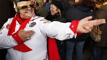Elvis Presley fan Lori Vigil, of Denver, poses in an Elvis costume as she attends festivities commemorating Presley's 75th birthday on Friday, Jan. 8, 2010 in Memphis, Tenn. (AP Photo/Mark Humphrey) 