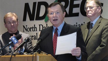 U.S. Rep. Earl Pomeroy, D-N.D., reads the text of legislation he has introduced to block EPA regulation of greenhouse gas emissions during a news conference at the headquarters of the North Dakota Association of Rural Electric Cooperatives in Mandan, N.D. 