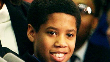 In this March 18, 2008 photo, Gov. David Paterson, D-N.Y. raises the hand of his teenage son, Alex Paterson, after Paterson was sworn in as New York state's 55th governor in Albany, N.Y. Fifteen-year-old Alex Paterson was detained by New York City police  