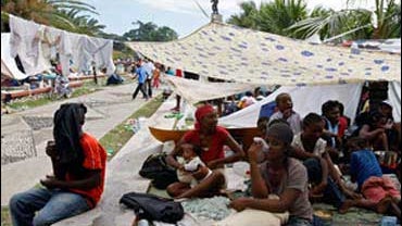 Earthquake survivors gather in the central public garden of Port-au-Prince, Haiti on Thursday, Jan. 14, 2010. 