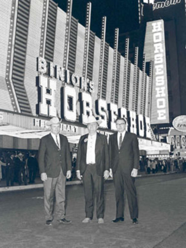 Benny Binion, center, and two unidentified men pose in front of Binion's Horseshoe casino on April 17, 1968. 