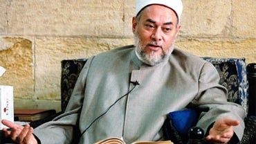 Egypt's Grand Mufti Ali Gomaa, head of Dar al-Iftaa, or the House of Fatwa, one of Egypt's most important institutions for issuing fatwas, speaks in Al-Azhar mosque in Cairo, Egypt, in this 2004 file photo. A growing number of Muslims are using the Intern 