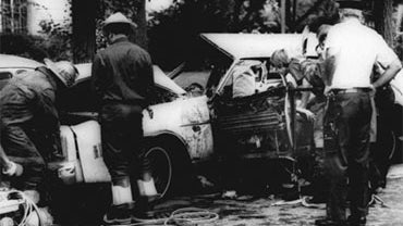 Firemen remove victims from a car shattered by a bomb blast on Embassy Row in Washington, D.C. Sept. 21, 1976.  