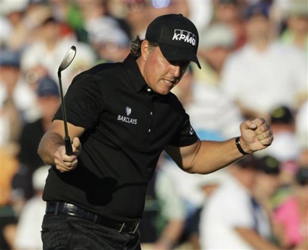 Phil Mickelson celebrates after winning the Masters golf 