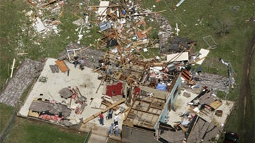 Debris is scattered from a house in Scotland, Ark., Saturday, May 1, 2010, after a tornado struck the area late Friday. 